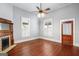 Bright bedroom featuring two windows and hardwood floors at 85 Bryan St, Mcdonough, GA 30253