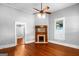 Bright bedroom featuring a fireplace and hardwood floors at 85 Bryan St, Mcdonough, GA 30253