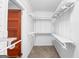 Walk in closet with custom shelving and wooden door at 85 Bryan St, Mcdonough, GA 30253