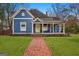 Charming two-story home with a brick pathway and manicured lawn at 85 Bryan St, Mcdonough, GA 30253