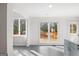 An open kitchen and dining area with sliding glass doors that lead to a wooden deck at 85 Bryan St, Mcdonough, GA 30253