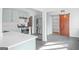 Modern kitchen with stainless steel appliances, quartz countertops, and a stylish barn door at 85 Bryan St, Mcdonough, GA 30253