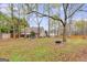 Expansive backyard featuring mature trees, lush greenery, and a peaceful setting for outdoor enjoyment at 324 Sue Ct, Temple, GA 30179