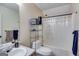 Bathroom with a shower and toiletries on shelving at 324 Sue Ct, Temple, GA 30179