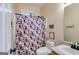 Bathroom with a floral shower curtain and vanity with sink at 324 Sue Ct, Temple, GA 30179