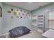Bedroom with a beanbag and multiple blank frames on the wall at 324 Sue Ct, Temple, GA 30179