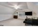 Bonus room with sloped ceilings, ceiling fan, TV, and carpet at 324 Sue Ct, Temple, GA 30179
