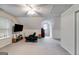 Large bonus room with carpet, a ceiling fan, and a TV at 324 Sue Ct, Temple, GA 30179