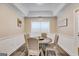 Charming dining room featuring a round wooden table and four upholstered chairs at 324 Sue Ct, Temple, GA 30179