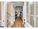 View of the entryway and living room with hardwood floors and a staircase at 324 Sue Ct, Temple, GA 30179