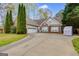 Charming brick and siding home featuring a spacious driveway and well-maintained landscaping at 324 Sue Ct, Temple, GA 30179