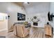 Bright living room with a fireplace, large windows, vaulted ceiling, and comfortable seating at 324 Sue Ct, Temple, GA 30179