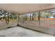Enclosed porch offers a serene view of the backyard, ideal for outdoor relaxation and enjoyment at 324 Sue Ct, Temple, GA 30179