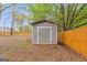 Well-maintained backyard storage shed provides practical outdoor storage and complements the landscape at 324 Sue Ct, Temple, GA 30179