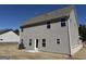 Spacious backyard featuring neutral siding, complementary roof, and a door with multiple windows at 465 Cantrell Drive, Dallas, GA 30157