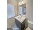 Bathroom featuring a dark vanity with a white countertop at 3695 Andover St, Cumming, GA 30028