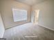 Neutral bedroom with carpeted floors and a large window that provide ample natural light at 3695 Andover St, Cumming, GA 30028