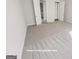 Primary bedroom showing plush carpet and ensuite bath with dual closets at 3695 Andover St, Cumming, GA 30028