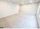 A spacious bedroom featuring neutral carpet, white walls, and bright, natural lighting from the windows at 3695 Andover St, Cumming, GA 30028
