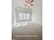 Spacious primary bedroom features a tray ceiling, carpeted floors, and plenty of natural light at 3695 Andover St, Cumming, GA 30028