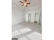 Large primary bedroom with tray ceilings, neutral colored paint, carpet, and multiple windows at 3695 Andover St, Cumming, GA 30028