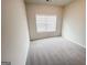 Bright bedroom with carpeted floors and a window that provides plenty of natural light at 3695 Andover St, Cumming, GA 30028