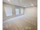 Spacious bonus room with neutral walls and carpet at 3695 Andover St, Cumming, GA 30028