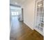 Hallway view of office with french doors, open staircase, and large living area at 3695 Andover St, Cumming, GA 30028