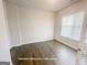 Downstairs office with beautiful wood floors and a large window providing natural light at 3695 Andover St, Cumming, GA 30028