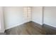 Office space showcasing french doors, beautiful wood floors, and neutral wall paint at 3695 Andover St, Cumming, GA 30028