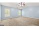 Large bedroom featuring two windows for natural light and soft, neutral carpeting at 784 Brookside Parc Ln, Avondale Estates, GA 30002