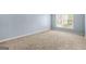 Bright bedroom featuring neutral carpeting and a window offering soft, natural light at 784 Brookside Parc Ln, Avondale Estates, GA 30002