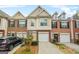 Charming townhome featuring a brick facade, attached garage, and well-maintained landscaping in a desirable neighborhood at 784 Brookside Parc Ln, Avondale Estates, GA 30002