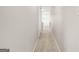 Neutral hallway with carpet, leading to other rooms, offering a seamless transition throughout the home at 784 Brookside Parc Ln, Avondale Estates, GA 30002