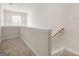Upper landing area with neutral carpeting, a small window, and staircase access, offering a bright and functional transition space at 784 Brookside Parc Ln, Avondale Estates, GA 30002