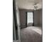 Neutral bedroom featuring a ceiling fan, carpet, and light-filled window with blinds at 2160 Creekview Trl, Decatur, GA 30035