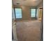 Cozy bedroom featuring carpet, two windows, and easy access to the en-suite bathroom at 2160 Creekview Trl, Decatur, GA 30035