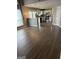 Open concept living area with breakfast bar, stainless steel appliances, and hardwood floors at 2160 Creekview Trl, Decatur, GA 30035