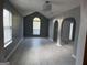Spacious living room featuring tile floors, modern lighting, and arched doorways at 2160 Creekview Trl, Decatur, GA 30035
