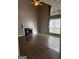 Bright living room featuring hardwood floors, a fireplace, and large windows for ample natural light at 2160 Creekview Trl, Decatur, GA 30035