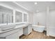 Elegant bathroom with dual sinks, modern mirrors and a freestanding tub and separate shower at 328 Wandering Brook Dr # 39, Mcdonough, GA 30253