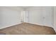 Bedroom with neutral carpet, white walls, and an interior door leading to a hallway at 328 Wandering Brook Dr # 39, Mcdonough, GA 30253