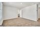 A carpeted bedroom features windows and a bathroom entrance, offering plenty of natural light at 328 Wandering Brook Dr # 39, Mcdonough, GA 30253