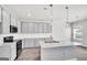 Modern kitchen with gray cabinets, granite countertops, and stainless-steel appliances at 328 Wandering Brook Dr # 39, Mcdonough, GA 30253