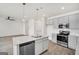 Bright kitchen features gray cabinets, stainless appliances, and a large island with a sink at 328 Wandering Brook Dr # 39, Mcdonough, GA 30253