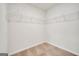 A simple walk-in closet featuring wire shelving and carpeted flooring at 328 Wandering Brook Dr # 39, Mcdonough, GA 30253