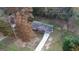 Aerial view showcasing the house nestled among mature trees at 321 Summerwood Ln, Stockbridge, GA 30281