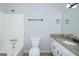 Bright bathroom with granite countertops, a tub, and white fixtures at 321 Summerwood Ln, Stockbridge, GA 30281