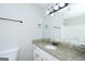 Well-lit bathroom featuring granite counters and updated fixtures at 321 Summerwood Ln, Stockbridge, GA 30281