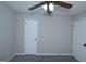 Bedroom with carpet, a fan and two doors at 321 Summerwood Ln, Stockbridge, GA 30281